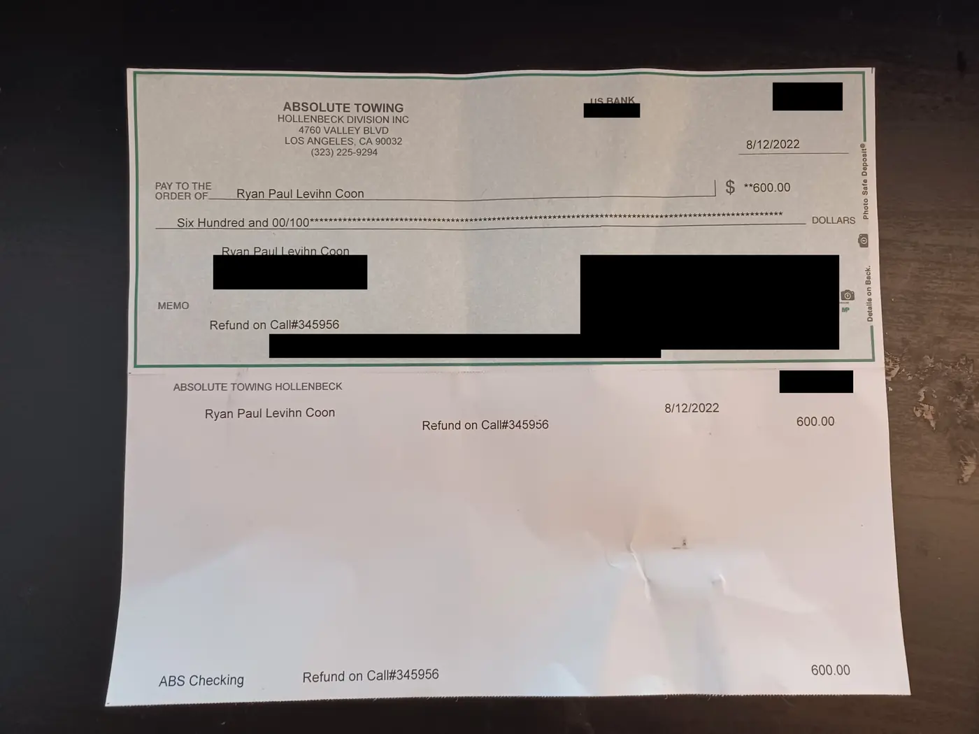 Check from Absolute Towing, Hollenbeck Division, to Ryan Levihn-Coon for $600.00, dated August 12, 2022, memo: refund on a call number. The bank, check and account numbers, the signature and the address are blacked out.